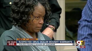 Woman charged with selling sealed search warrants