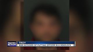 Man accused of putting officer in a headlock