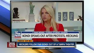 Protesters confront FL Attorney General at 'Won't You Be My Neighbor' showing in Tampa
