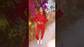 Czarina Silvia is wearing a red hot athleisurewear outfit from Czar Clothing