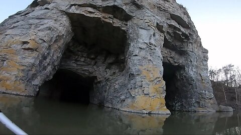 Kayaking Into A Tall Limestone Mine