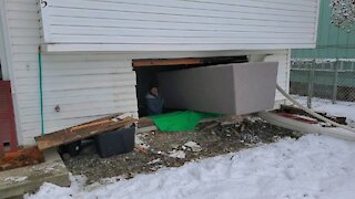 Homeowners have to remove entire window to fit couch into basement