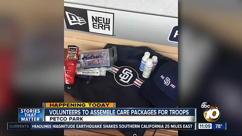 Volunteers assemble care packages for troops