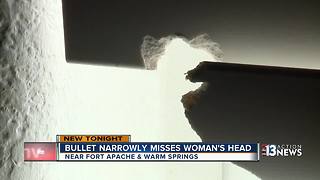 Bullet narrowly misses woman's head