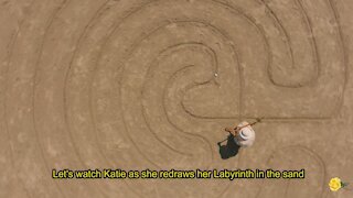 A Drone View of a Lady Drawing a Sand Labyrinth on the Beach at Port Aransas