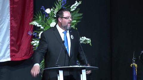 Dr. Holland delivers the eulogy at Southport Lt. Aaron Allan's funeral