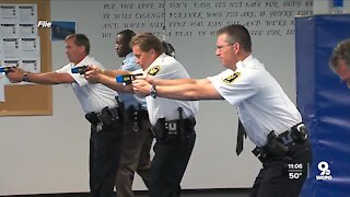How could a police officer mistake their weapon for a Taser?