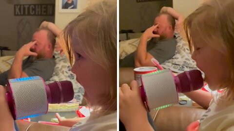 Dad Has Priceless Reaction When Daughter Sings Into Microphone