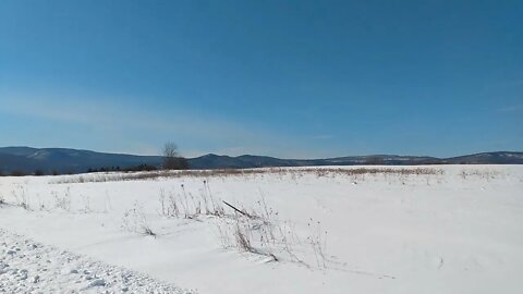 Snow Covered Field And Adirondack Mountains