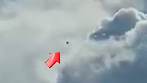 Black UFO floating left and right under the cloudy sky [Space]