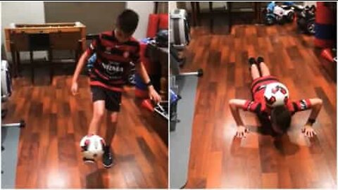 This kid does some impressive push-ups with a soccer ball