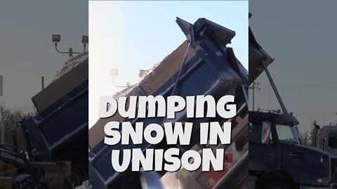 HUGE SNOW TRUCKS DUMPING SNOW IN UNISON