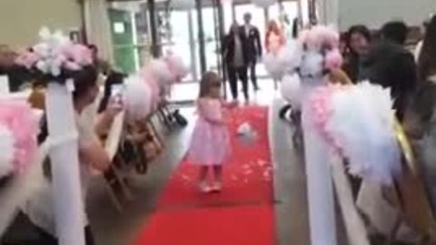 Flower girl repeatedly stops to blow kisses