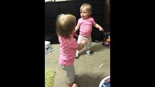 Baby girl adorably amused by squeaky shoes