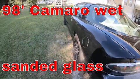 Wet sand and polish the quarter panel on the Camaro.