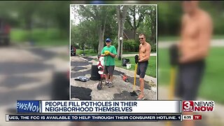 Residents Fill Potholes