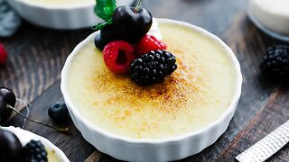 Rumchata Crème Brulee with Whipped Cream and Berries