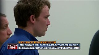 Man charged in shooting of off-duty police officer, son while hunting in court today