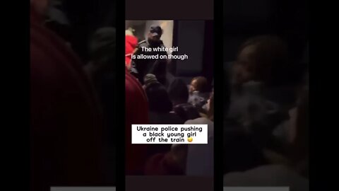 Ukraine Police pushing a black young girl off the train!