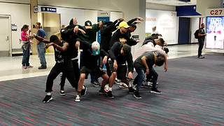 Dance Crew Entertains Passengers During A Long Flight Delay