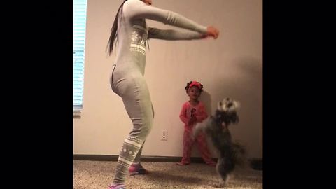 Mom, daughter & doggy have pajama dance party