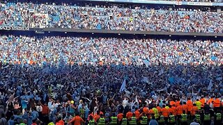 Manchester City fans flood the pitch after 1-0 win over Chelsea