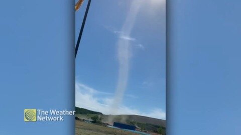 Thin dust devil reaches high into the sky