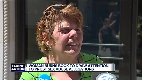 Woman burns book to draw attention to priest sex abuse allegations