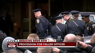 Fallen officer arrives downtown after police procession