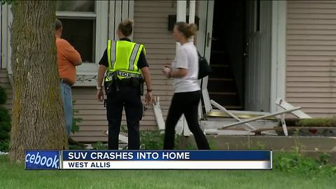 Car crashes into West Allis home after colliding with another vehicle