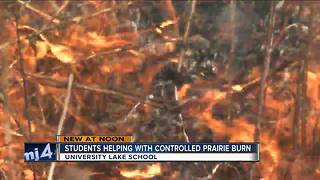 University Lake School students help with controlled prairie burn