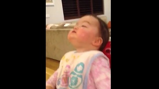 Baby discovers her nose for the first time