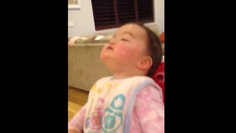 Baby discovers her nose for the first time