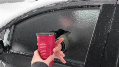 Punching Through Ice Window for Cup of Coffee