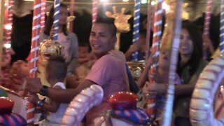 Aiza and kids on the merry go round
