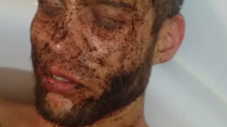 Guy ironically falls asleep with coffee on his face in the tub