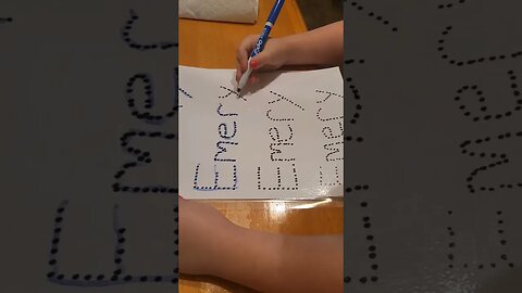 Teaching her to write her name