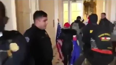 Police open doors and usher in protesters as they're allowed inside U S Capitol