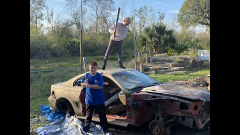 Smashing the rear window of a mustang