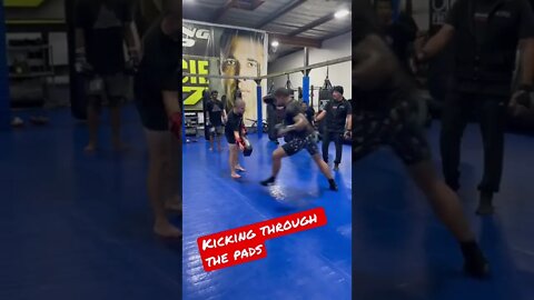 Kicking through the pads - Muay Thai