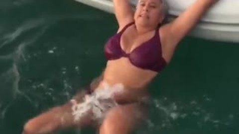 Lady Shows A Simple And Effortless Way To Get Into A Dingy If You Are Stuck In The Water.