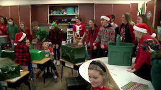 Oconomowoc High School students give presents to more than 200 Hadfield Elementary students