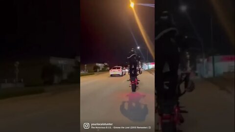 Wheelies next to cops!