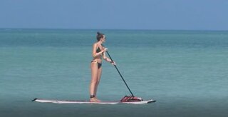 Paddleboarding on the sea, Isla Holbox, Yucatan, Mexico