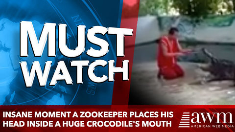 Insane moment a zookeeper places his HEAD inside a huge crocodile's mouth
