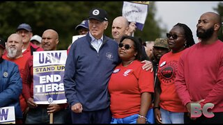 Biden makes history by joining striking US car workers