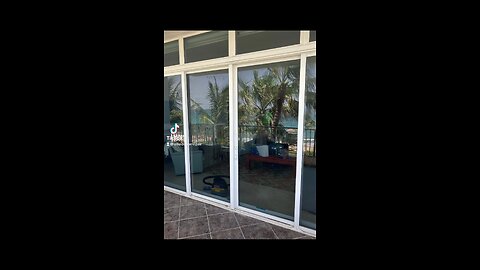 Hurricane impact sliding glass door repair; roller and track replacement, in Deerfield Beach, Fl.