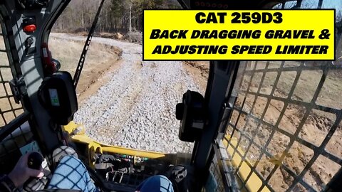 CAT 259D3 back dragging gravel and adjusting speed settings