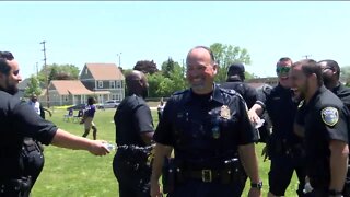 Milwaukee police celebrate partnership with elementary school with a game of kickball