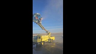 Airplane being sprayed before winter takeoff